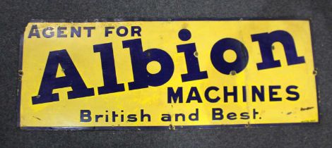 An enamel sign 'Agent for Albion Machines British and Best' with blue lettering on yellow ground