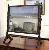 A 19th century mahogany framed dressing table mirror, the rectangular mirror plate with turned