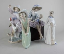 A group of Lladro of four figurines comprising of Teasing the Dog, Debbie and her Doll along with
