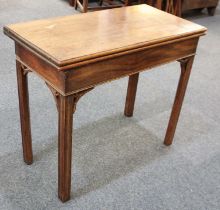 A mahogany rectangular card table with fold-over top on square chamfered legs, with pierced corner