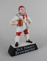 A Carlton Ware advertising figurine ‘Pick Flowers, Brewmaster’ number impressed 2583 to the base