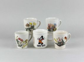 Four Staffordshire Potteries children's mugs, comprising one transfer decorated with The Magic