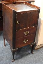 A George III style mahogany bedside cupboard with tray top, cupboard and two drawers, on cabriole