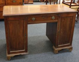 An early 20th century mahogany desk, by repute British Navy department, with rectangular top above