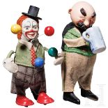 Zwei Schuco-Tanzfiguren - Trachtenfigur "Vater mit Bierkrug" sowie Clown als Jongleur