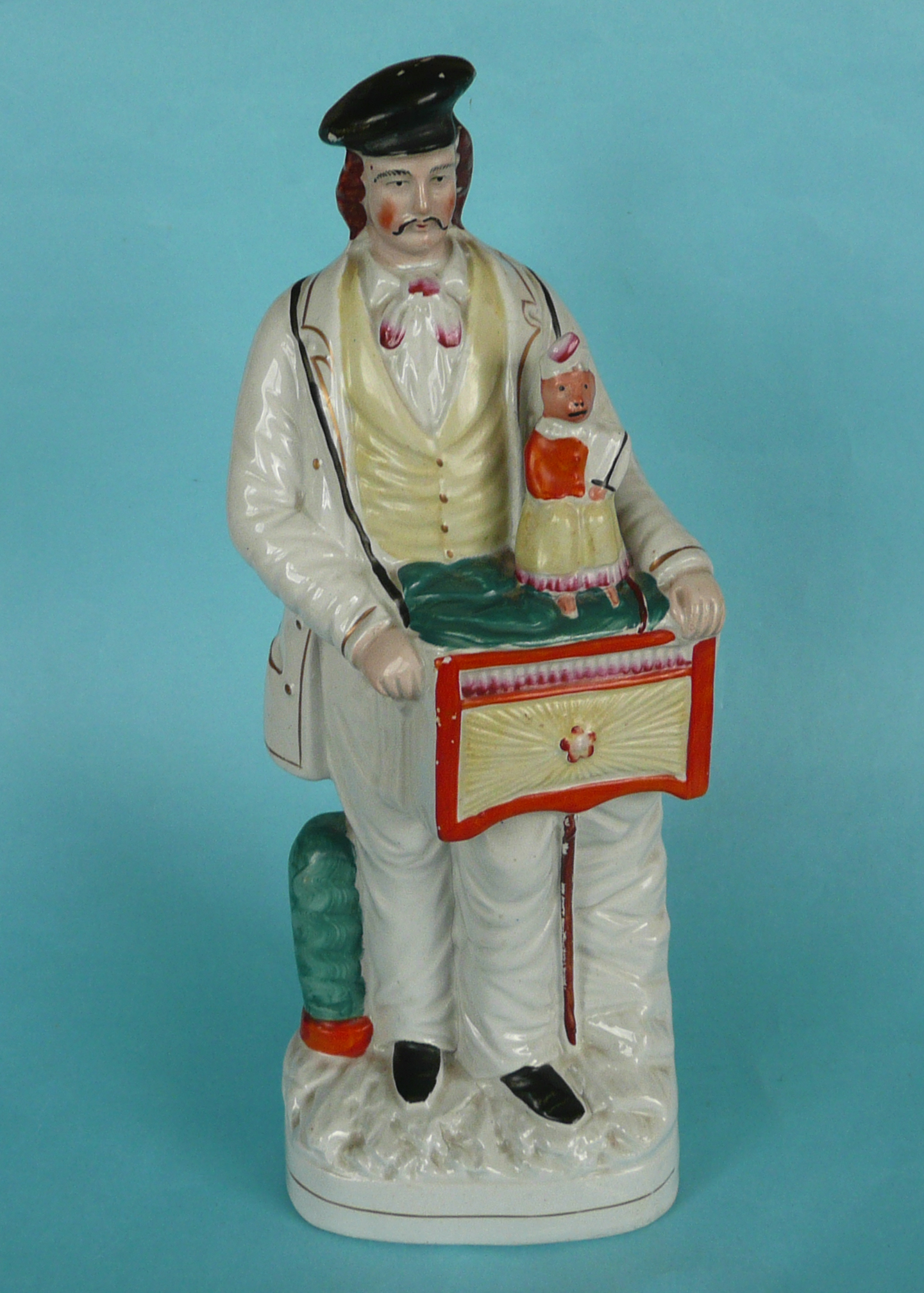 A good and colourful Staffordshire figure of an organ grinder with his monkey, circa 1850, 381mm