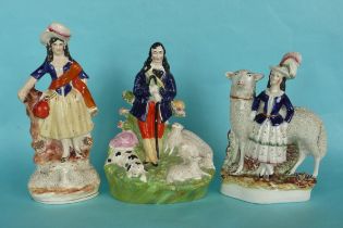 A colourful Staffordshire group of a shepherd and his flock, 245mm,