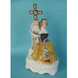 Jenny Lind as Alice: a colourful Staffordshire figure depicted clinging to a cross, circa 1847,