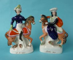A pair of equestrian Staffordshire figures of Sir Robert and Lady Sale, circa 1842, 204mm,