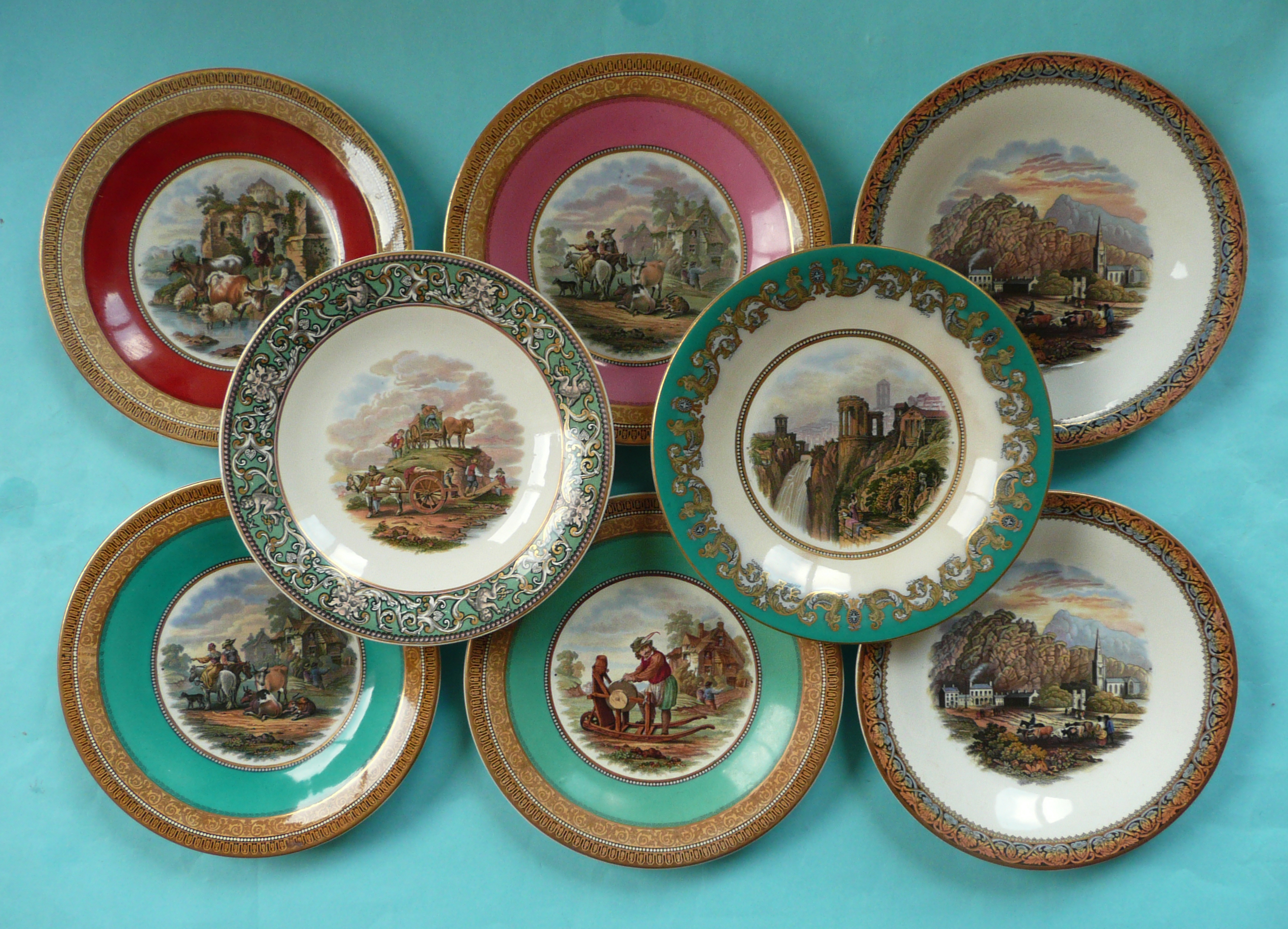 A dessert plate: The Quarry (352) unusual maskhead cherub and gilt scroll border