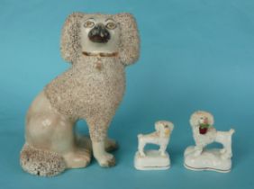 Two good Staffordshire pottery models of poodle dogs, circa 1860 and another larger, seated