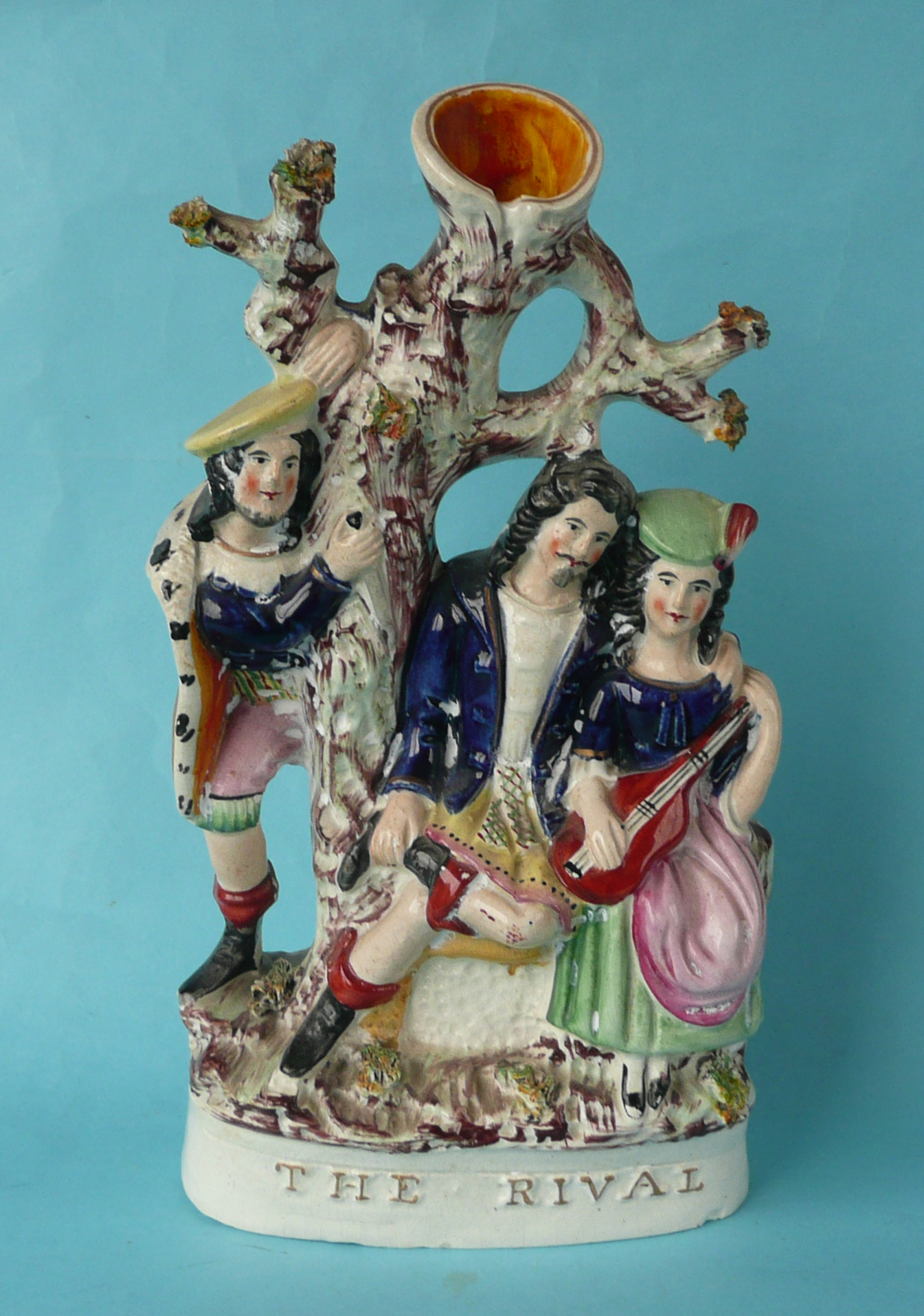 A good and colourful Staffordshire pottery group entitled ‘The Rivals’ in raised git letters,