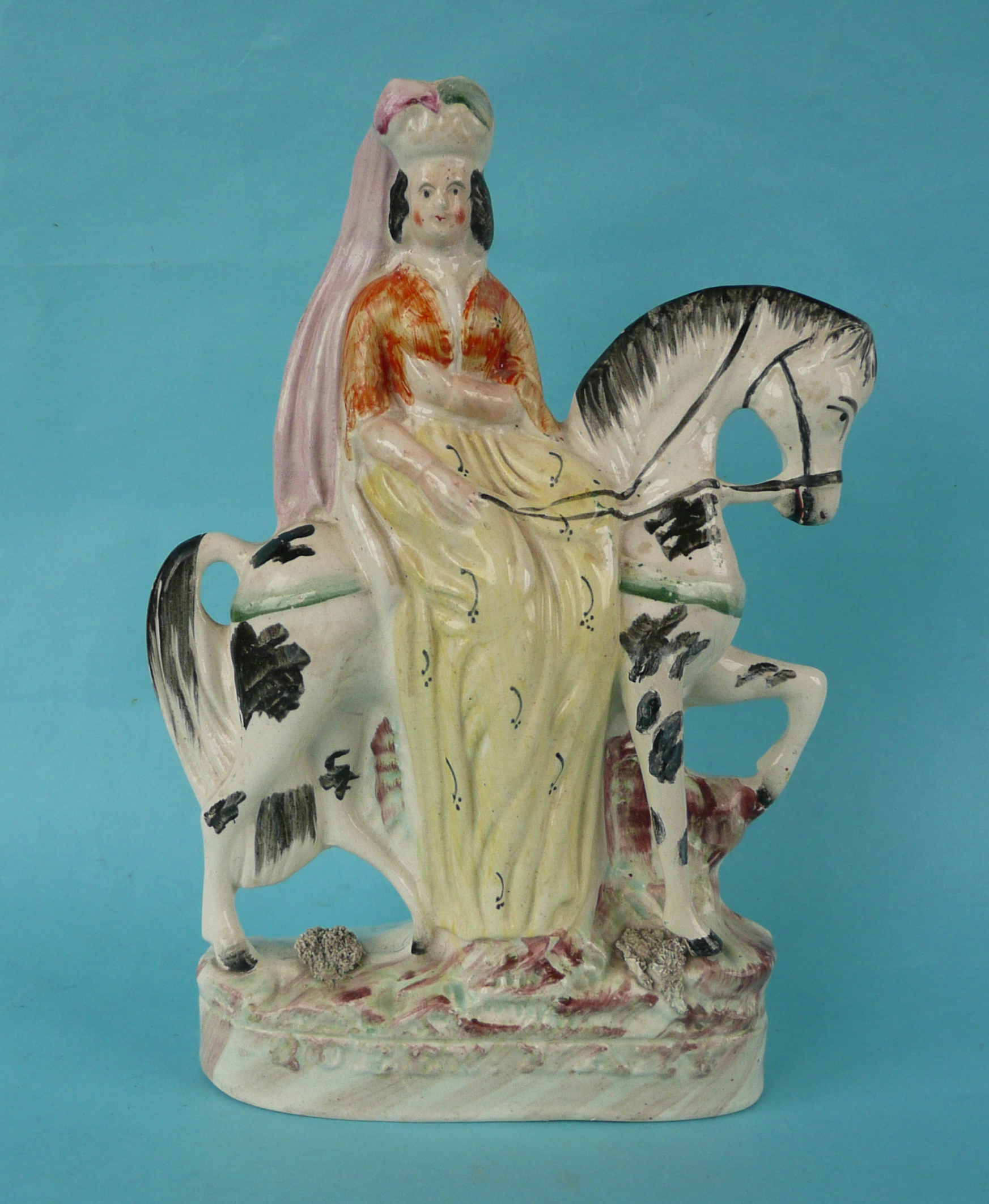 Queen Mary: a Staffordshire equestrian figure, named in raised letters, circa 1850, 264mm,