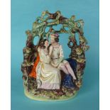 A colourful group by Thomas Parr depicting a couple embracing beneath an arbour, circa 1850,