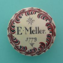 A documentary circular creamware box with domed cover painted in red and black with a scrolling