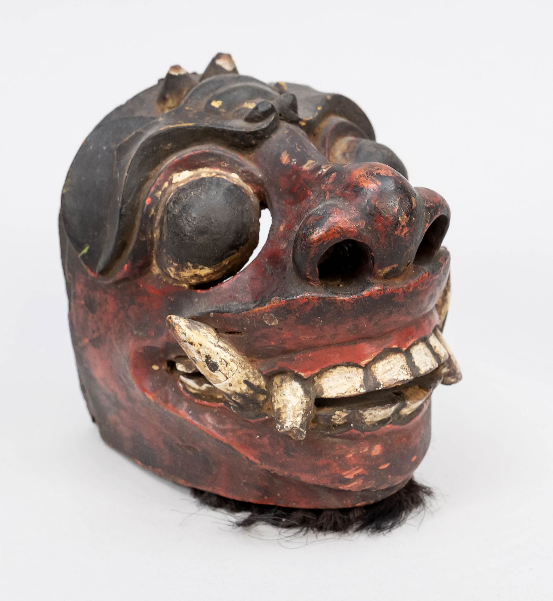 Mask Barong, probably Java 19th century, compact wooden mask painted with animal hair trimming,