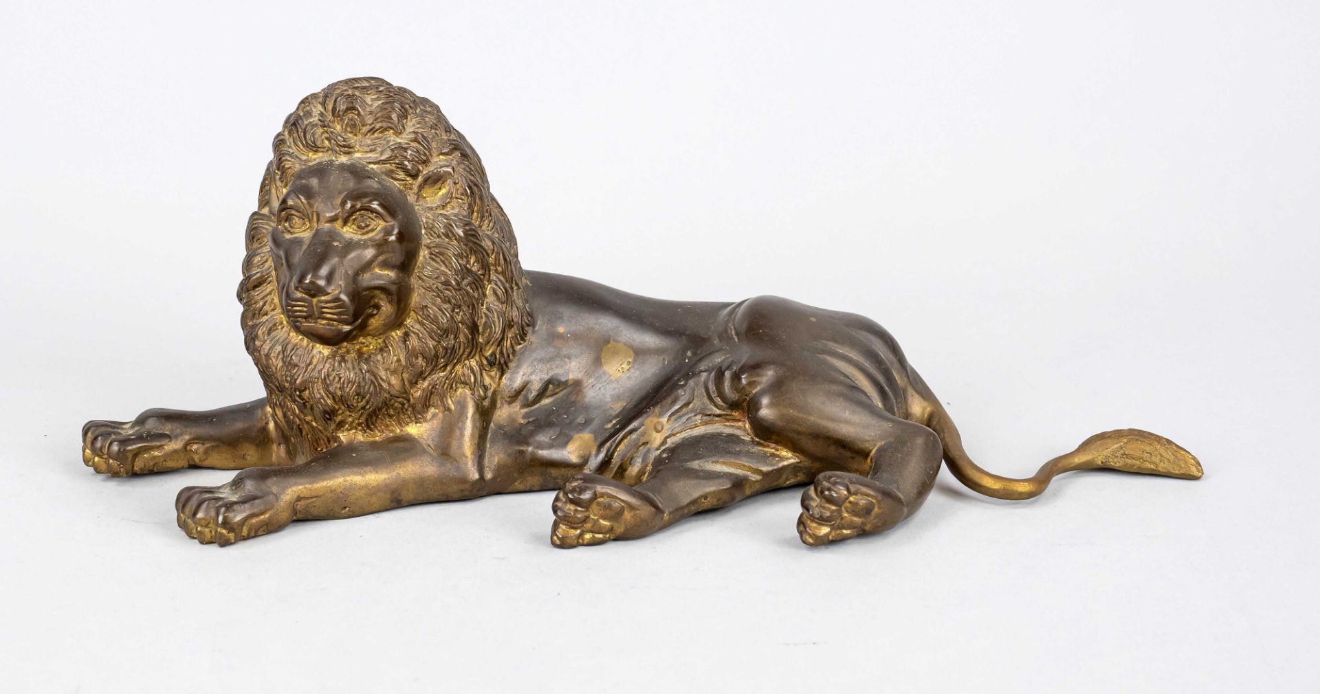 Sculptor mid 20th c., lying lion with finely chiselled mane, brown patinated bronze, unsigned,