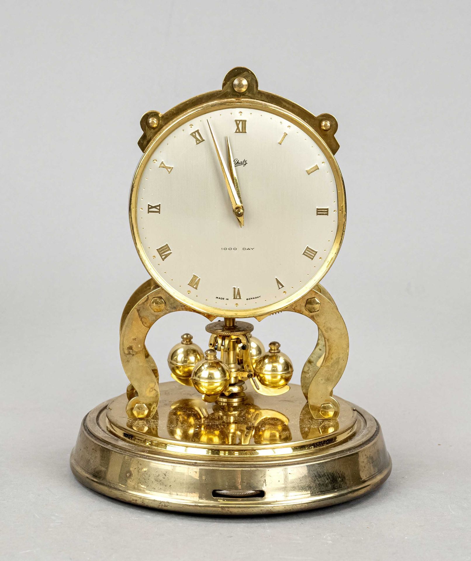 Table clock, treasure 1000 day, year clock, under plexiglass dome two small chips on lower rim,