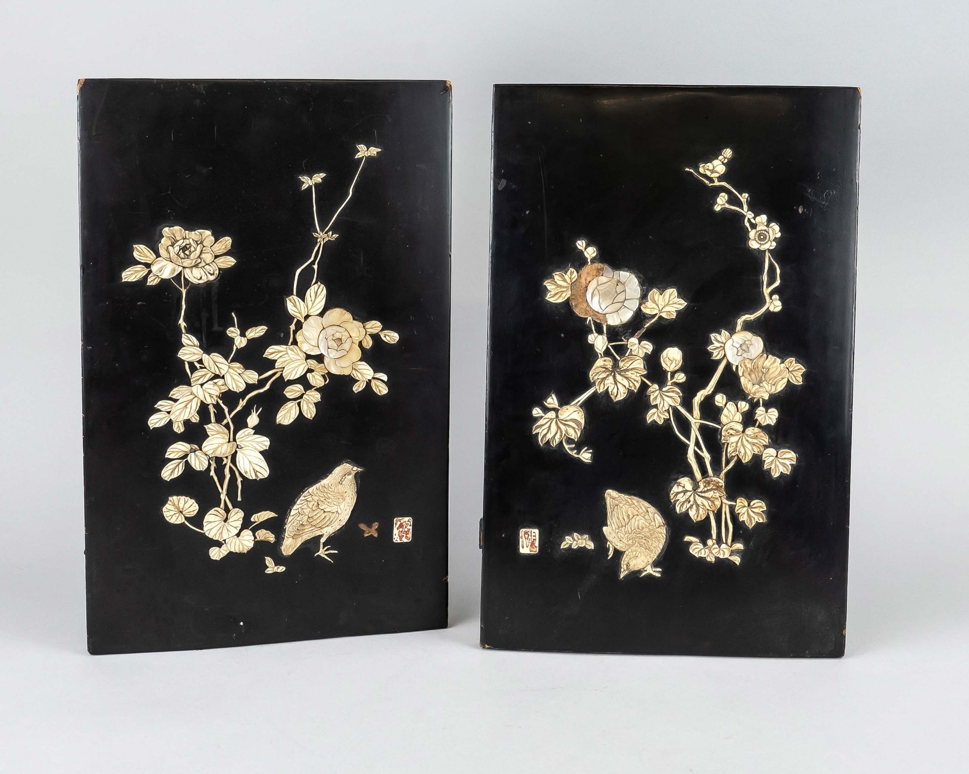 Pair of ornamental plaques, Japan, 1st half of 20th c., wood overlaid with black lacquer and