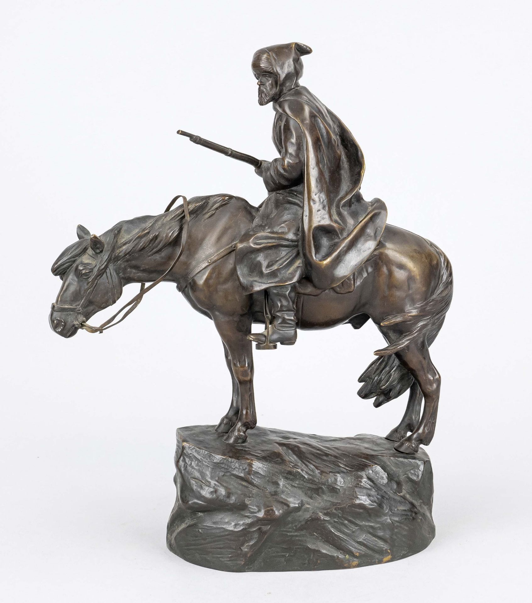 Moritz Wolff (1854-164), Cossack on horseback, brown patinated bronze on naturalistic rock base,