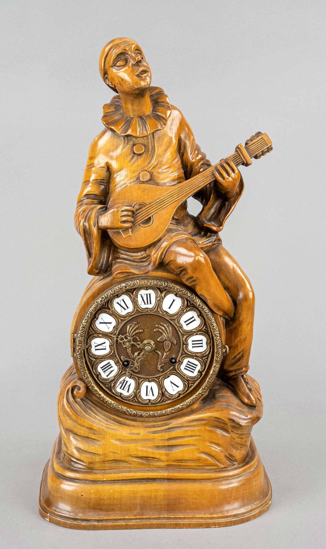 large hand carved Pierrot sitting on a clock and playing music, 2.h.20.c., bronze f. dial with art