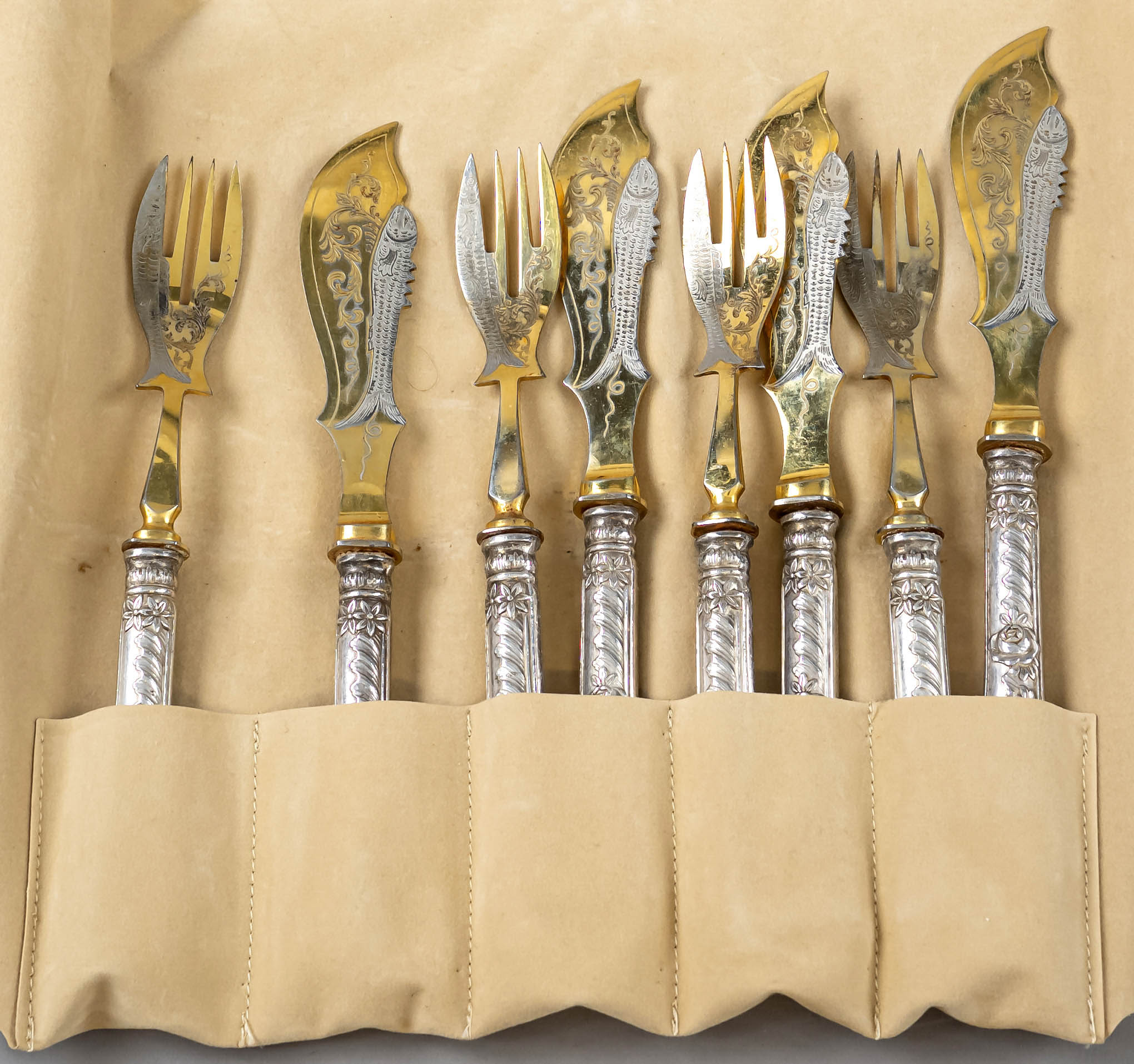 Fish cutlery for four persons, around 1900, silver tested, partial gilding, filled pistol handles