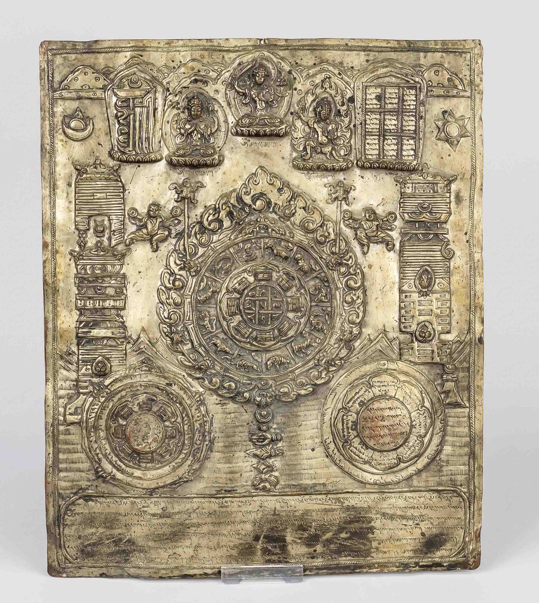 Mandala plaque, Nepal, 19th/20th c., white metal chased with the zodiac, Sojombo symbols and