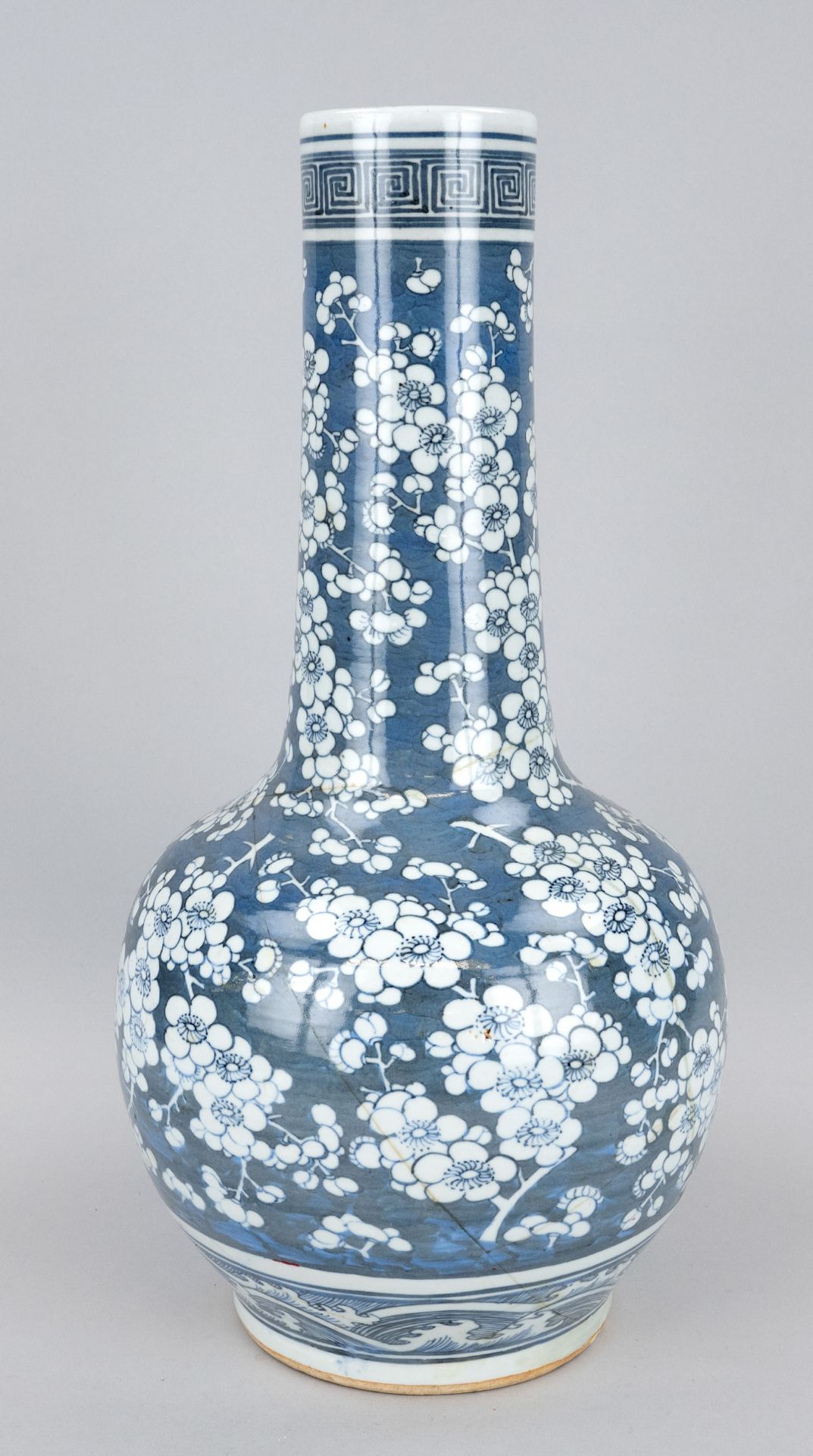 Large long-necked vase, China, 20th c., porcelain with cobalt blue glaze painting of plum blossoms