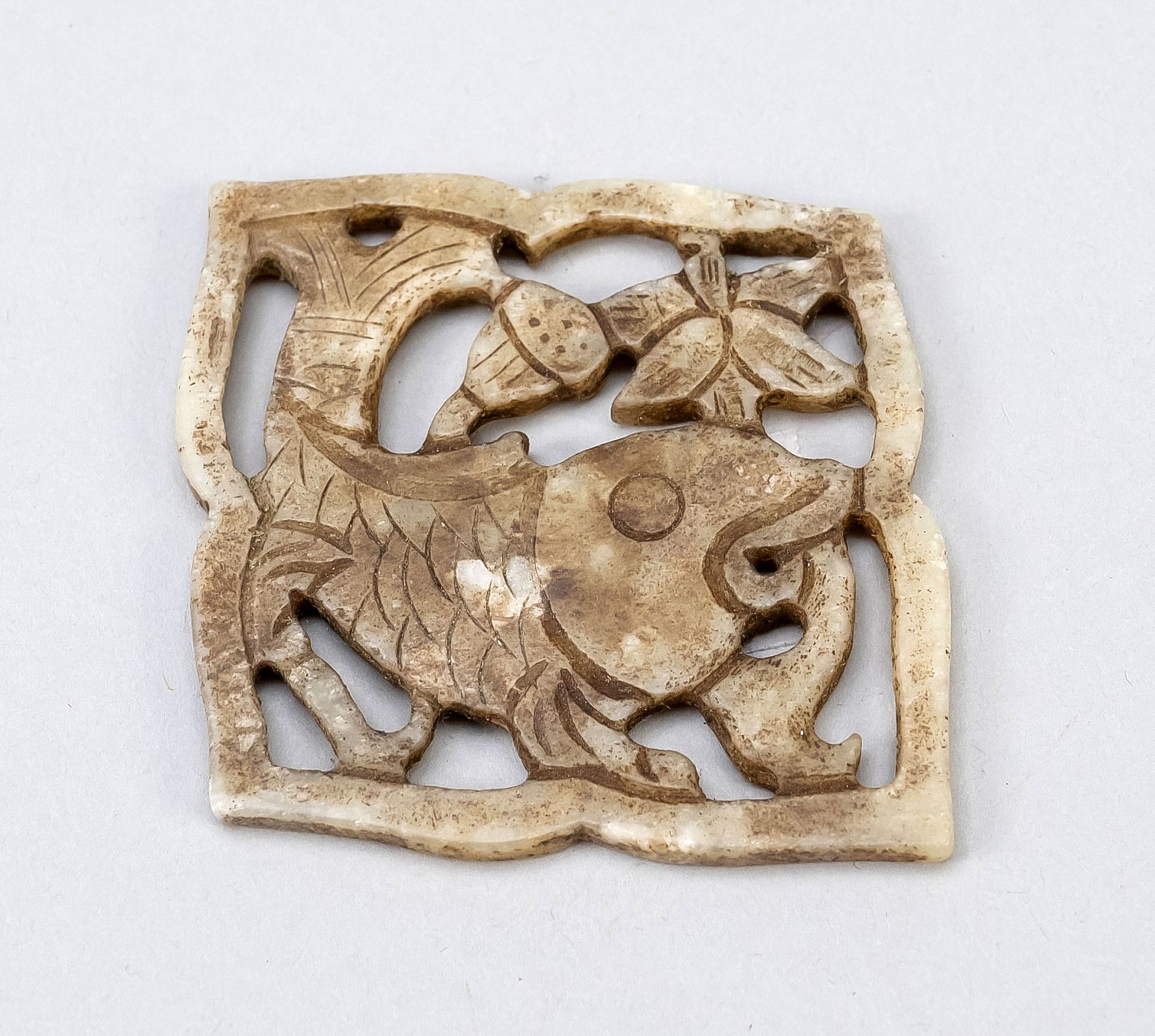 Jade amulet, China, probably Qing dynasty(1644-1912) Guangxu period(1875-1908), lozenge in flower