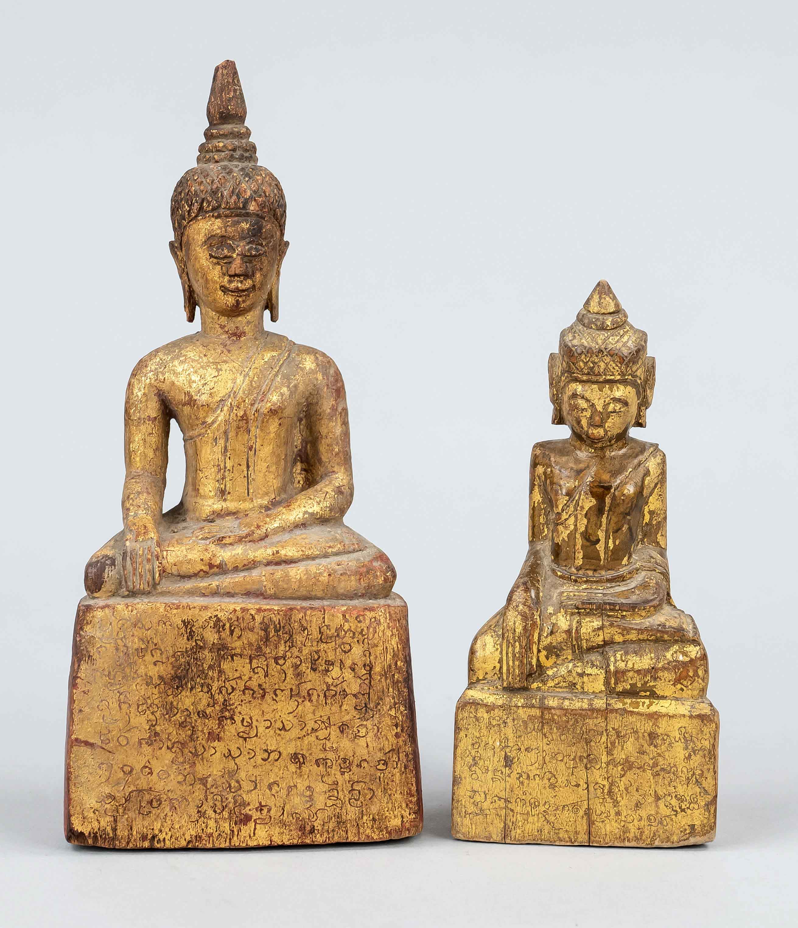 2 Buddhas, Thailand or Myanmar, 20th c., wood with red and gold lacquer, writing, h to 18,5cm