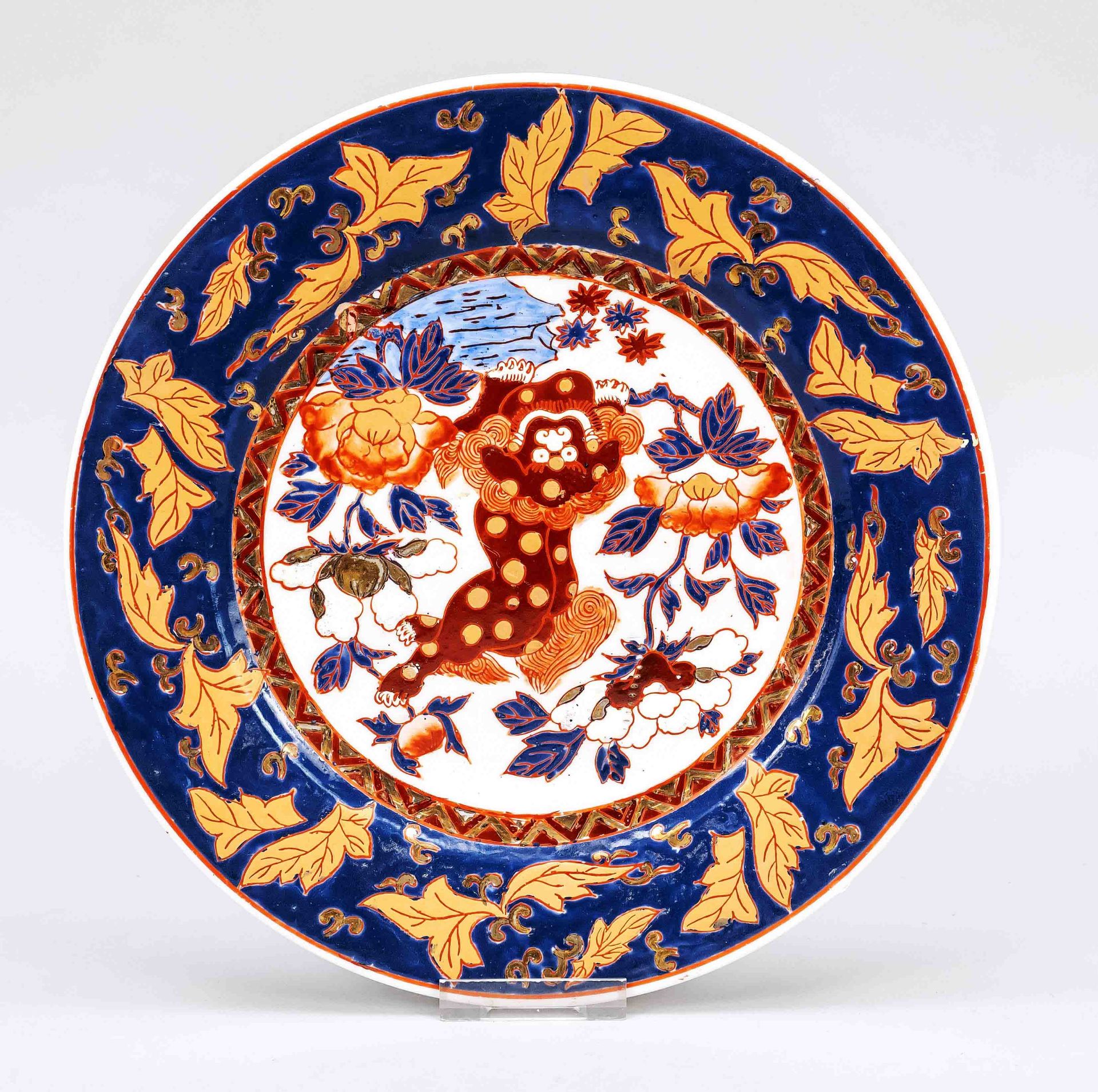 Imari plate, China, 20th century, porcelain with rich enamel and gold colors, in the center dotted