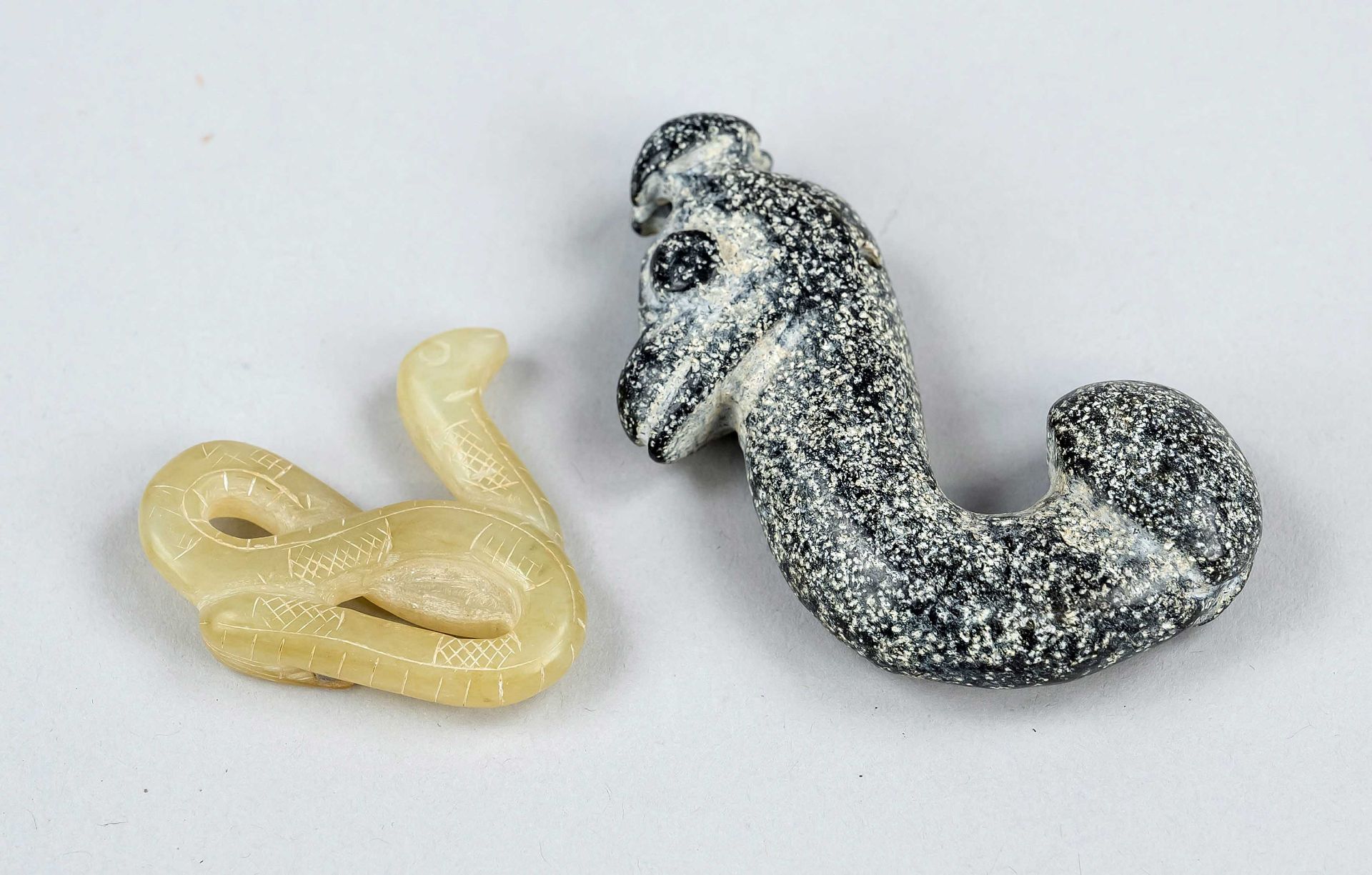 2xSnake-Long, China, 20th century, a snake with surprising tail end, yellowish jade and snowflake