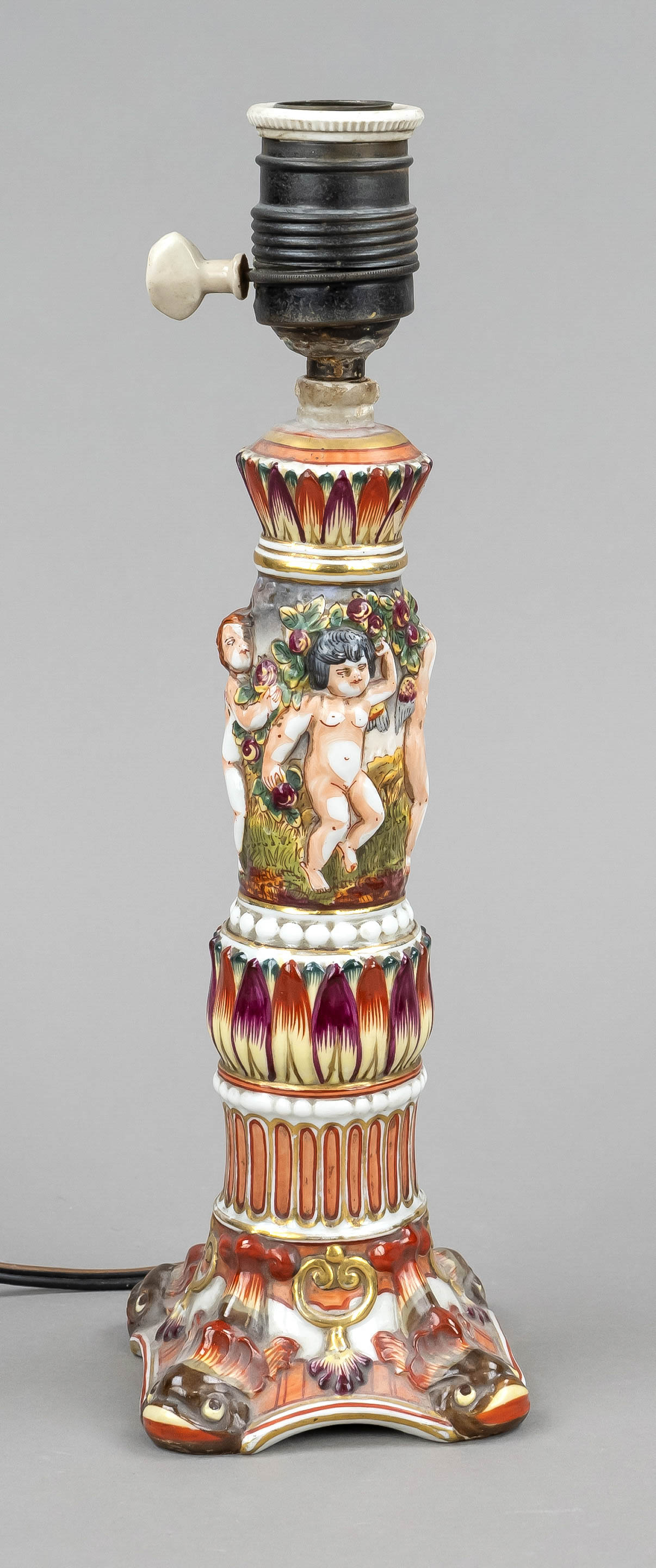 Lamp stand, Thuringia, 20th c., strong relief with putti and dolphins in Capodimonte style,
