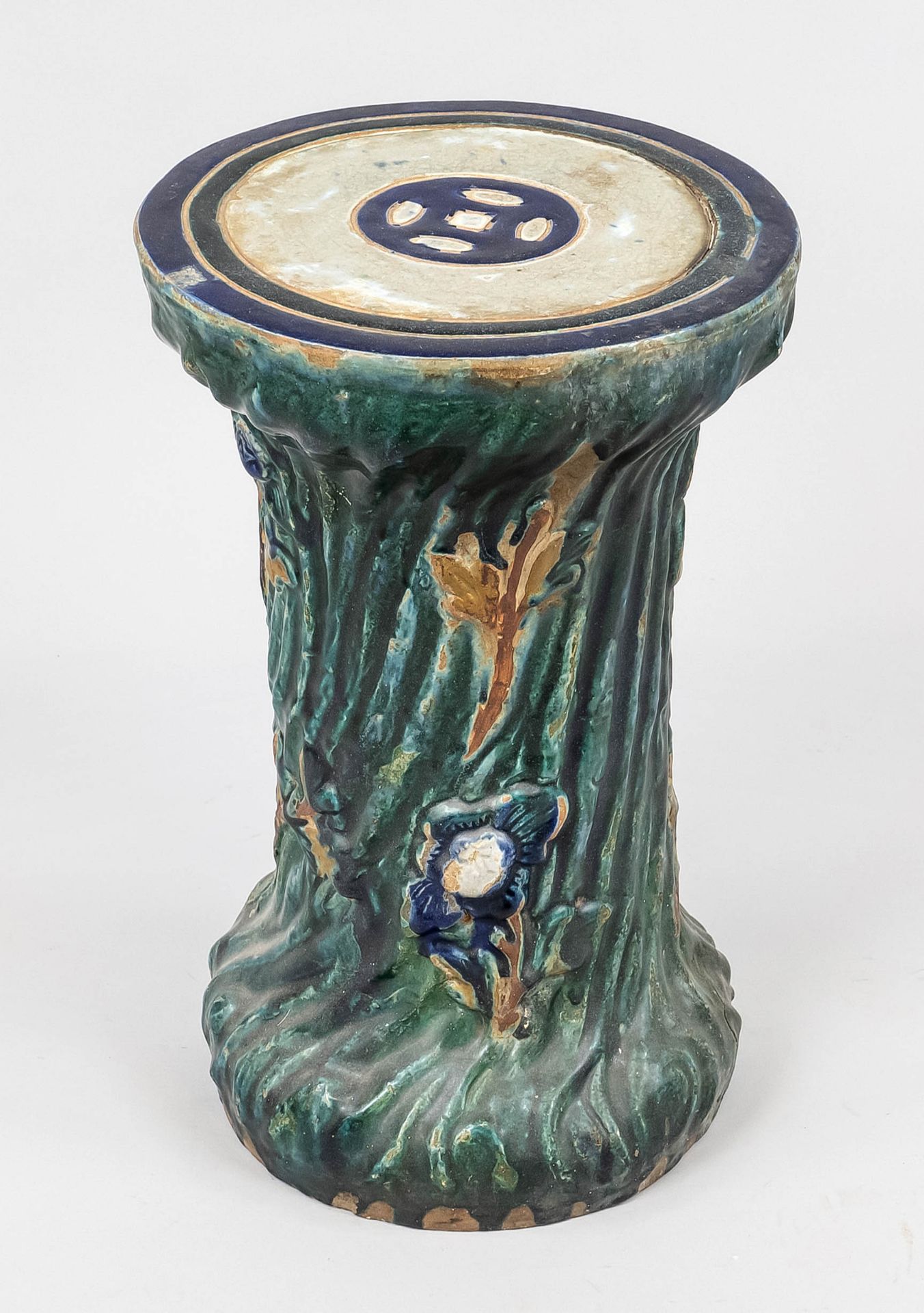 Ceramic stool, mid-20th c., relief decorated and polychrome glazed, slightly bumped, h. 51/d. seat