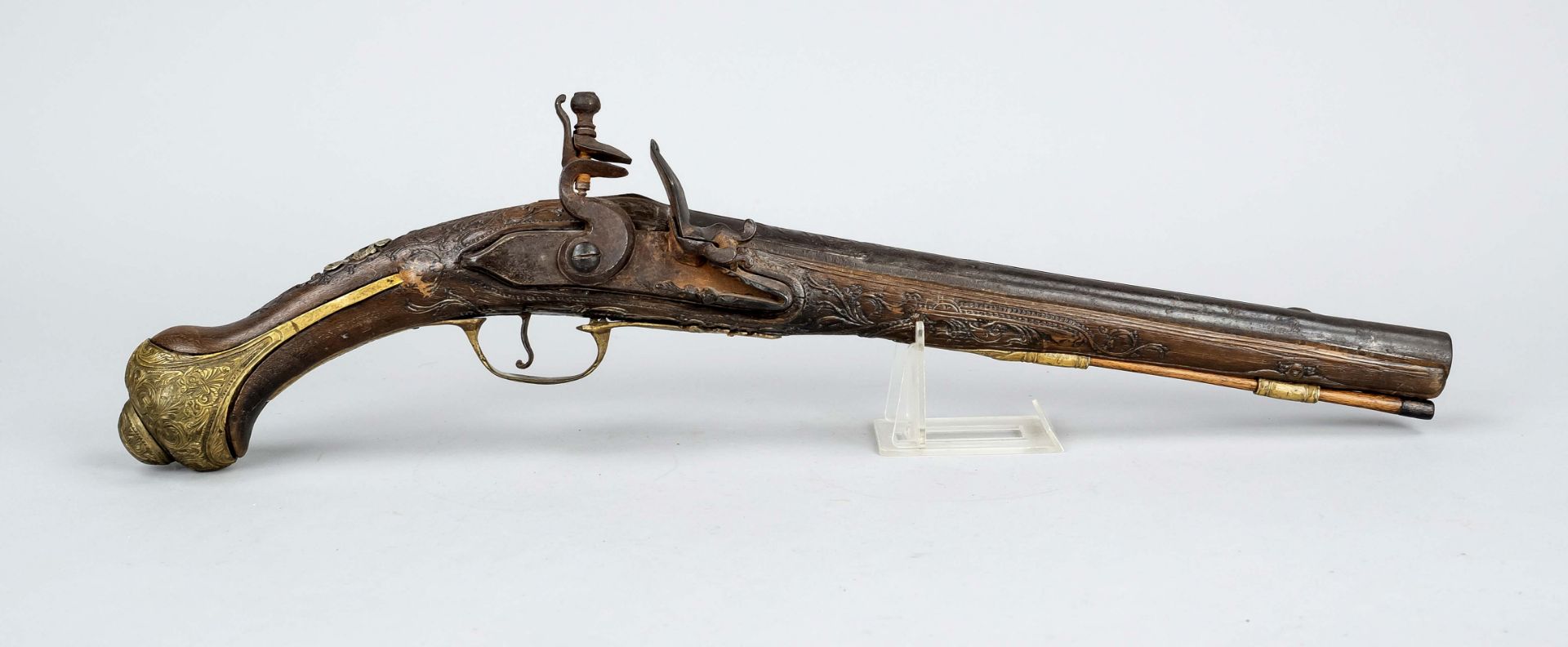 Flintlock pistol, 18th c. Walnut stock with fine carvings, brass fittings, richly decorated,