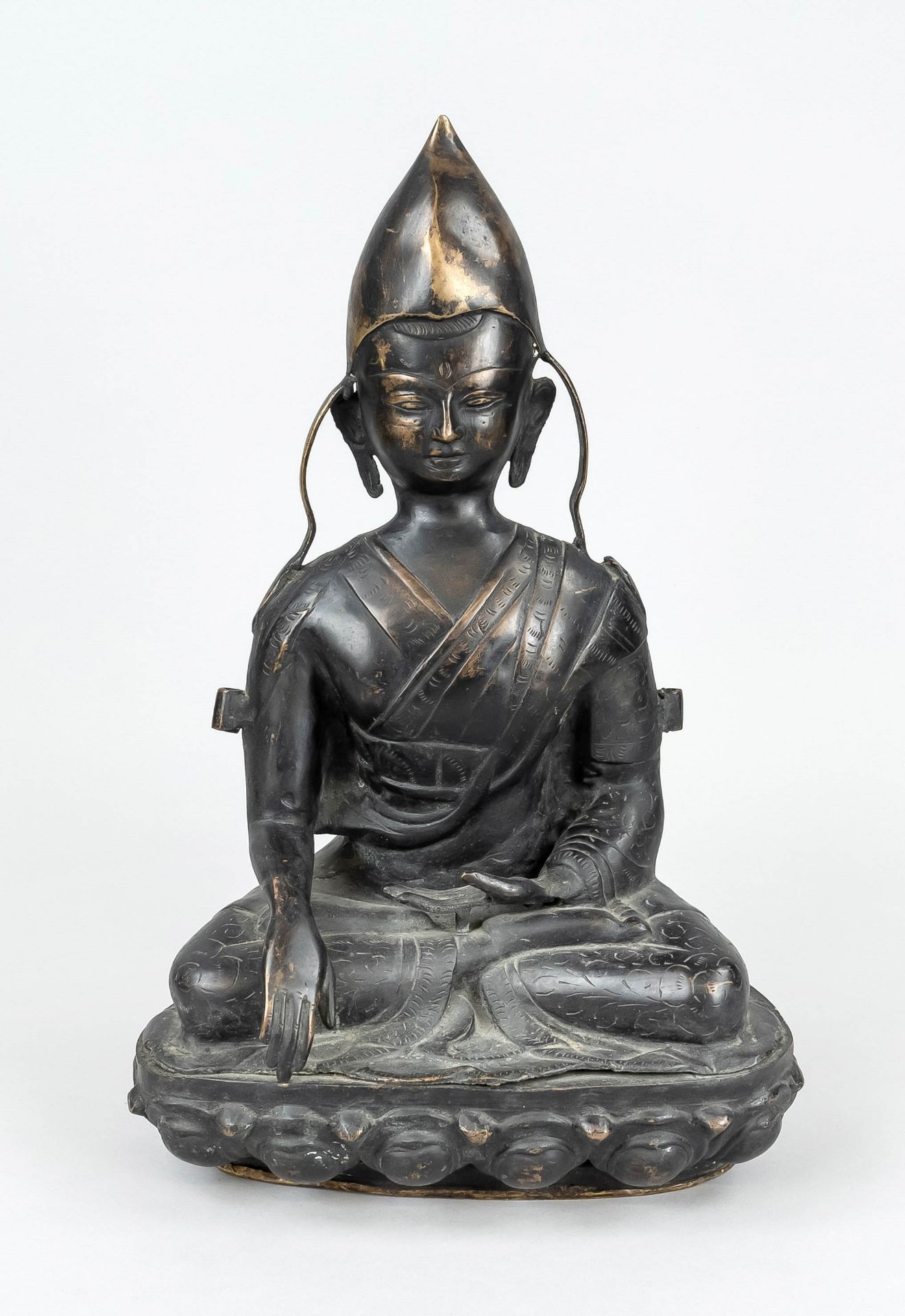 Tsongkhapa, probably Nepal, 20th century, bronzed yellow metal, seated figure of the Tibetan lama