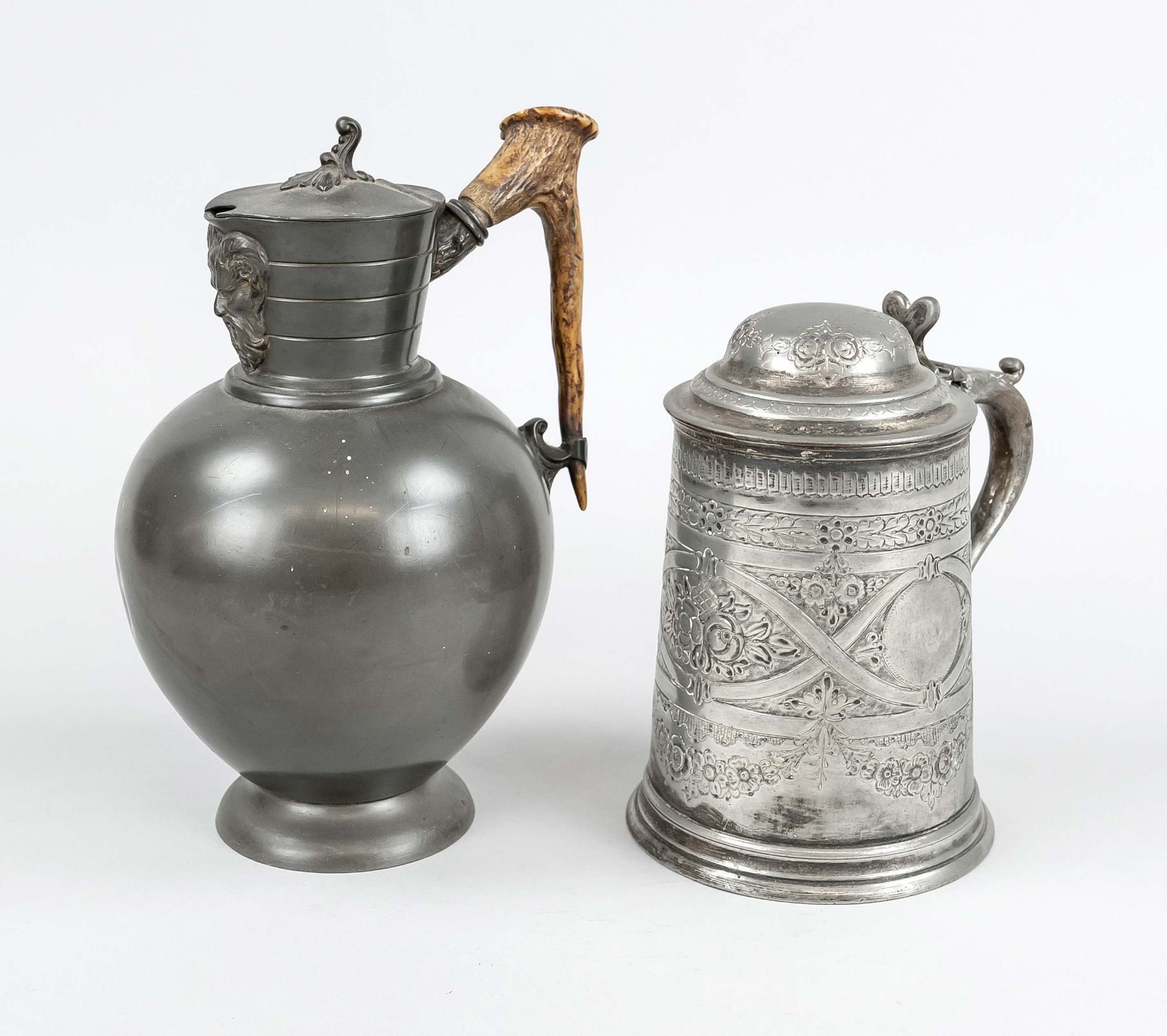 2 Pewter jugs, 1 x England (Sheffield), late 19th c., on the neck a satyr mascaron, handle as antler