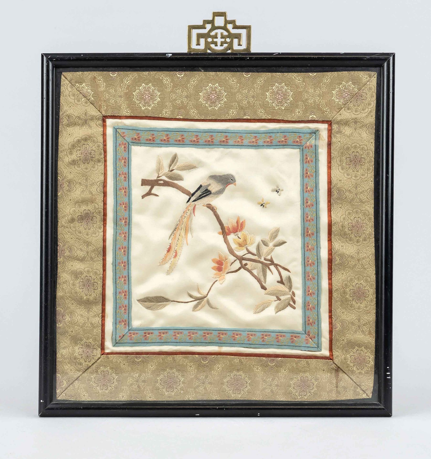 Embroidered picture, China, 20th century, embroidered silk bird on tree, framed behind glass,