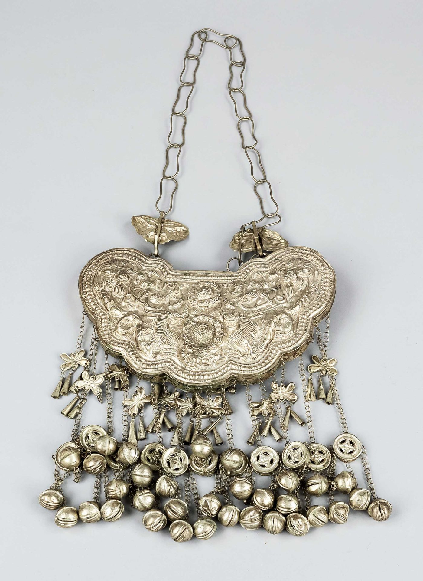 Jewelry plaque, China, 19th/20th c., chased white metal with numerous shimmering bells and