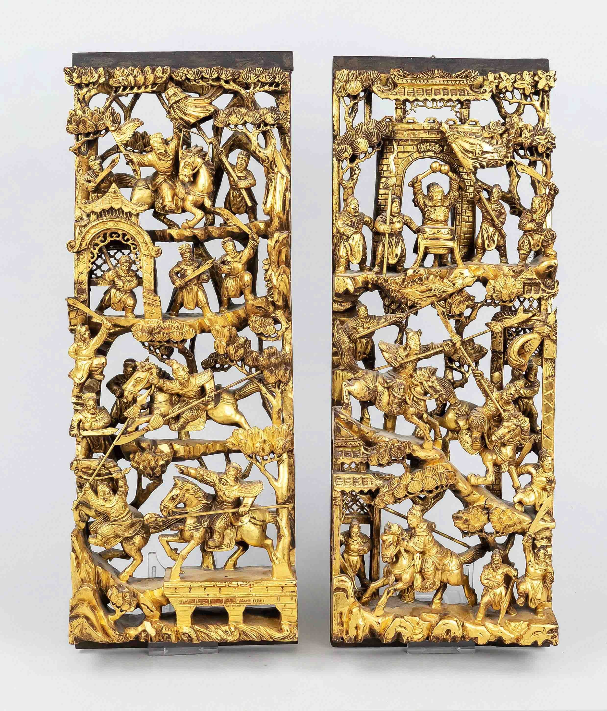 Pair of wooden panels, China, 20th century, wood carvings with elaborate openwork, colored in red