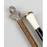 Reservist cane and riding crop, end of 19th c. Black lacquered wooden cane with brass cuff and