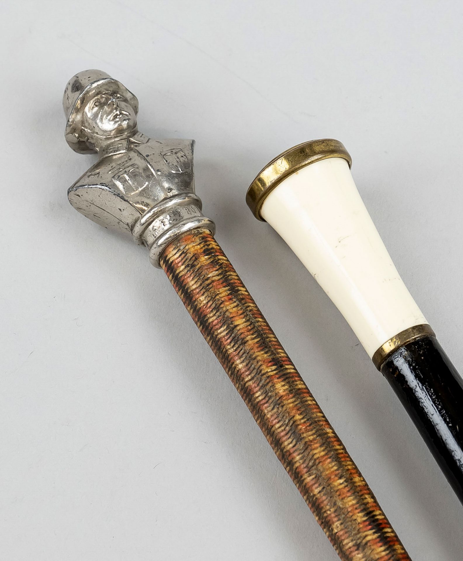 Reservist cane and riding crop, end of 19th c. Black lacquered wooden cane with brass cuff and