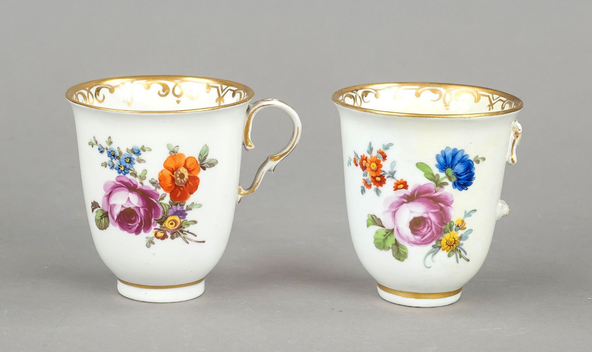 Two tall cups, Vienna, Du Paquier 1719-44, polychrome floral painting with gold lace border, 1