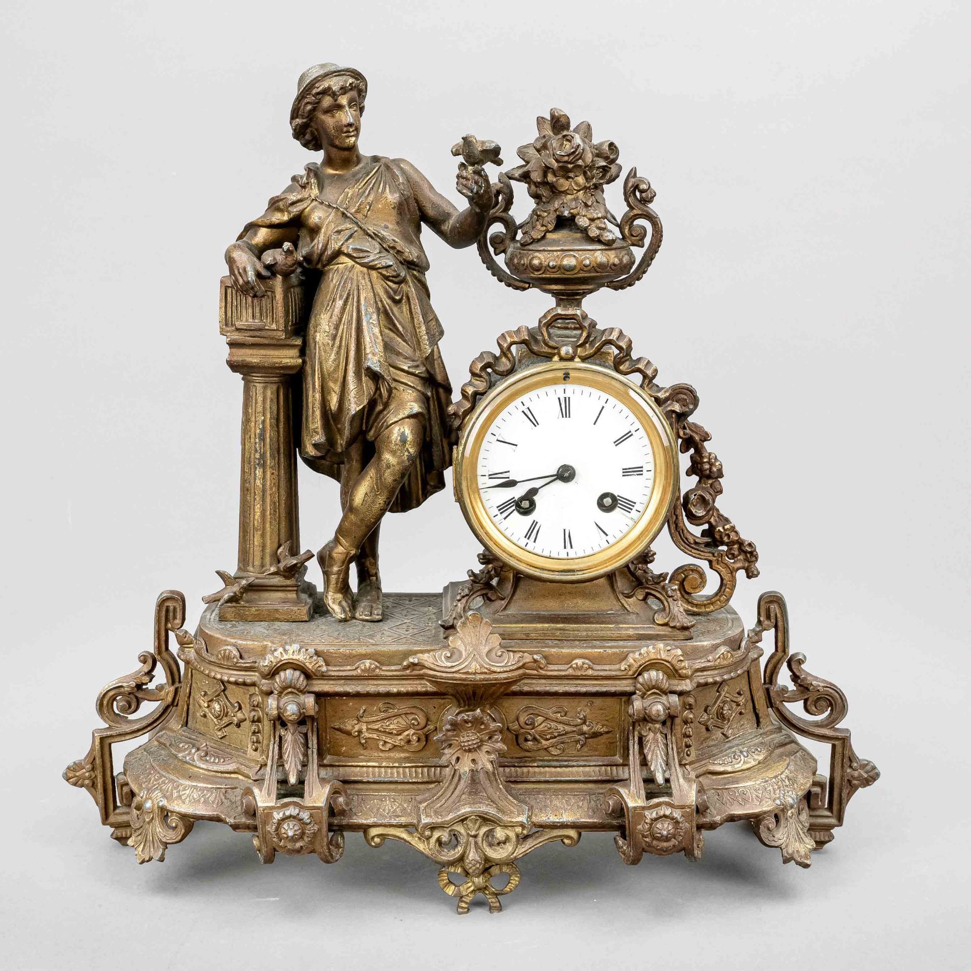 french. Figure pendulum, 2nd half 19th c., youth with doves on a column, above the clock drum a vase