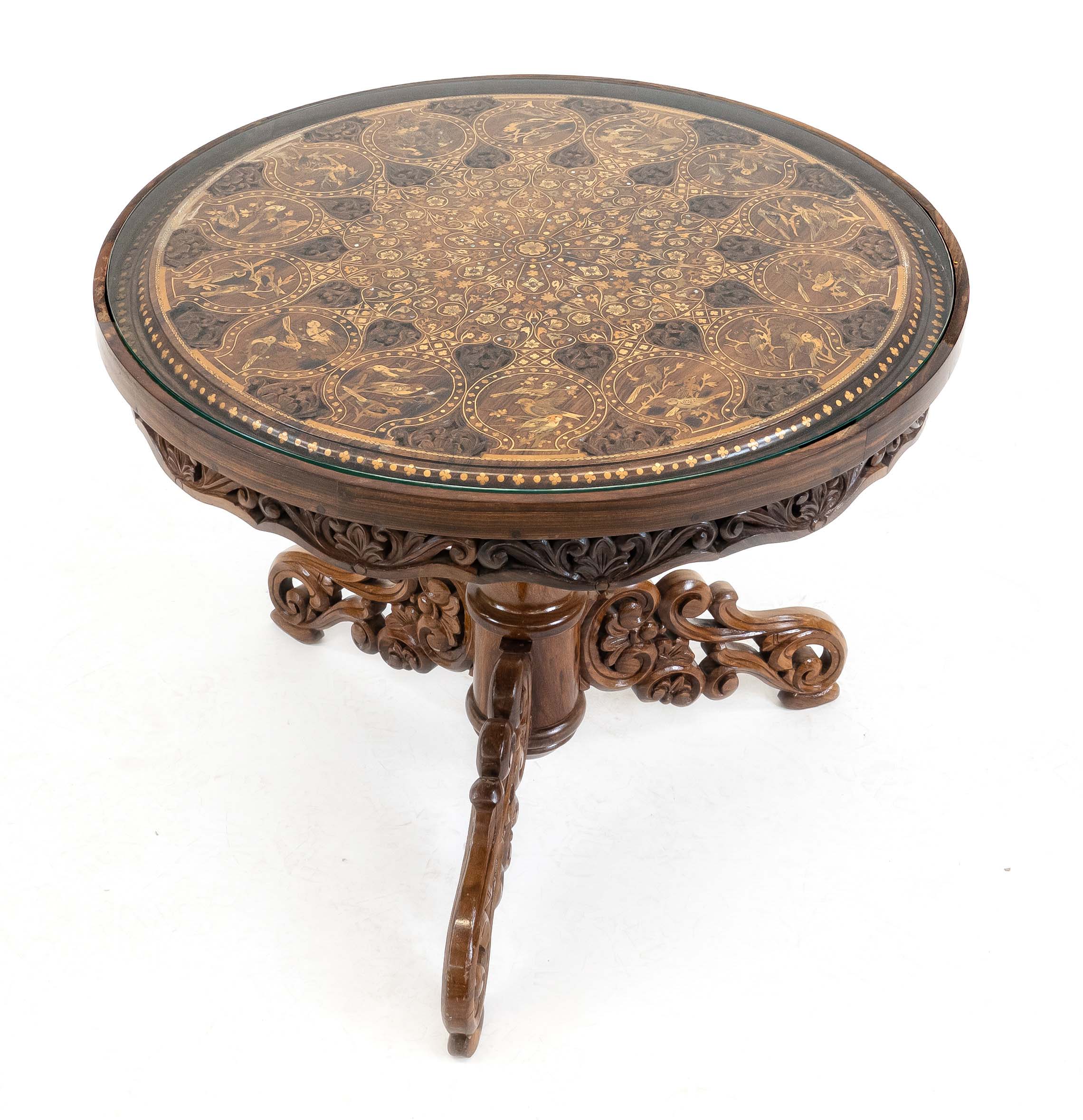Oriental side table, 20th c., walnut-like solid wood with luxuriant carving, top with inlaid various