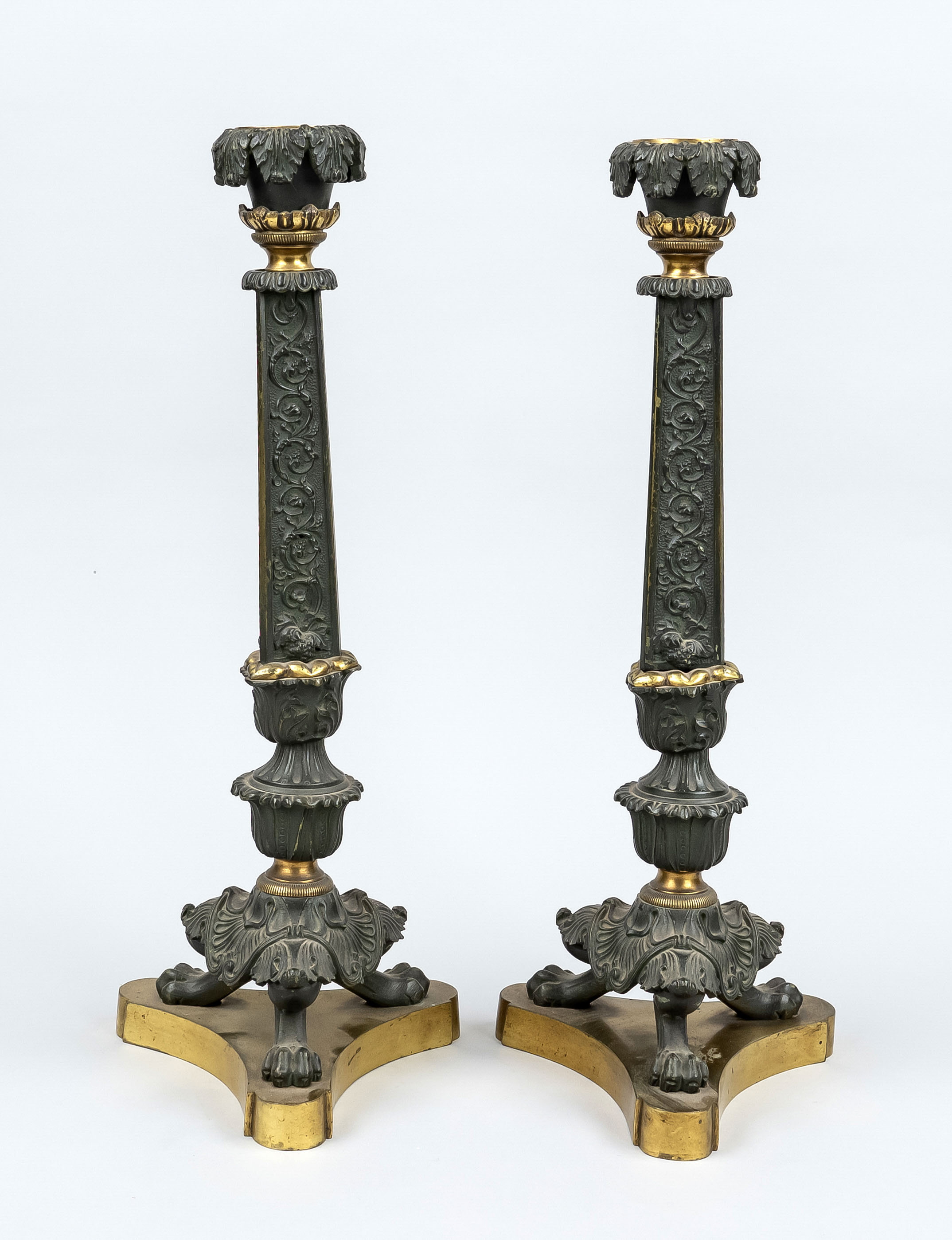 Pair of Empire style candlesticks, 19th century, bronze partially gilded. Tripod base, tripod with