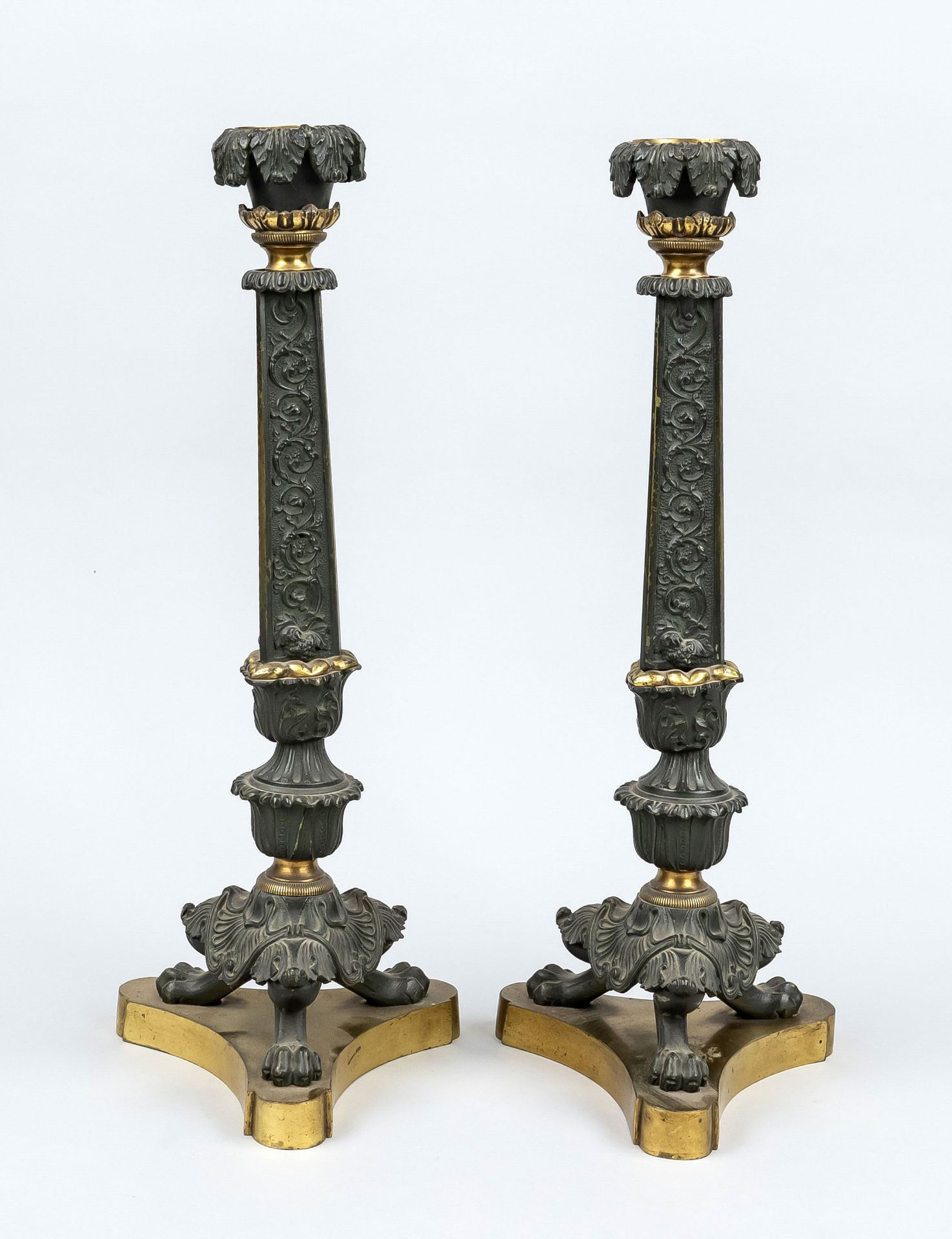 Pair of Empire style candlesticks, 19th century, bronze partially gilded. Tripod base, tripod with