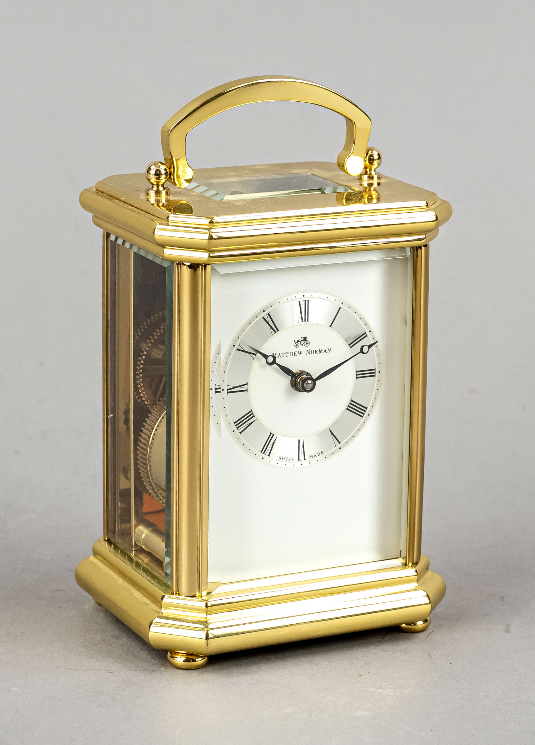 Travel alarm clock Matthew Norman, 2nd half 20th century, polished and fire gilded, all sides