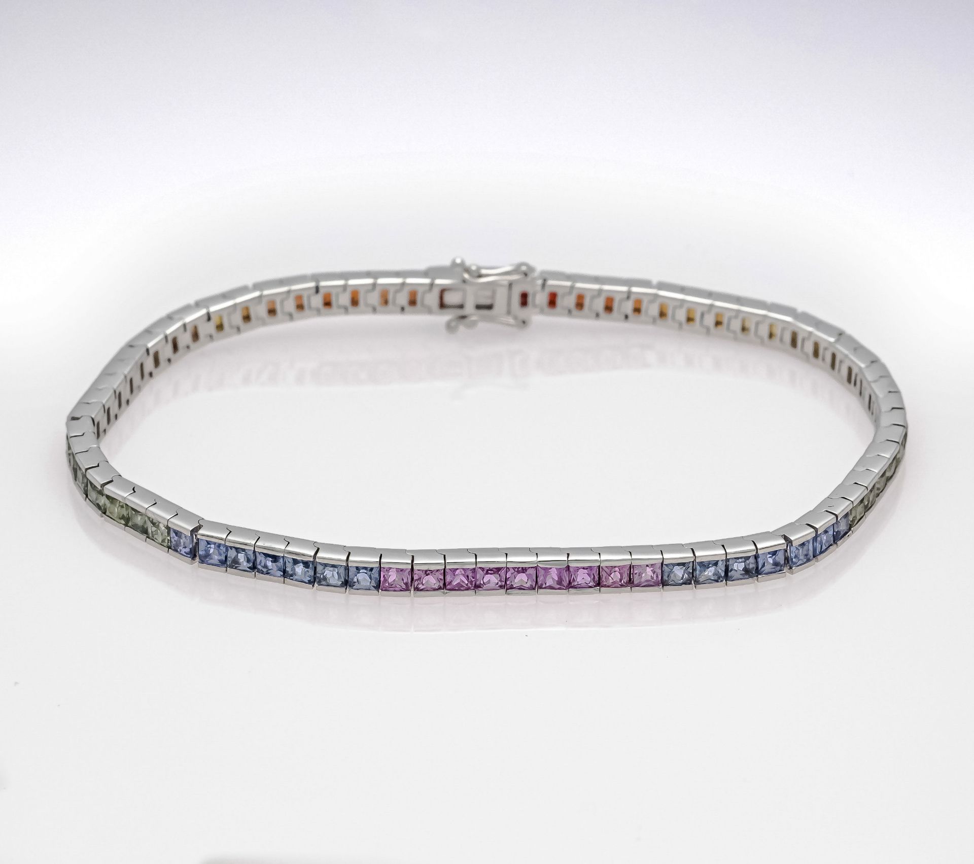 Rainbow riviére bracelet WG 750/000 with 72 sapphire carrées 2.6 mm in bright rainbow colors, eye-