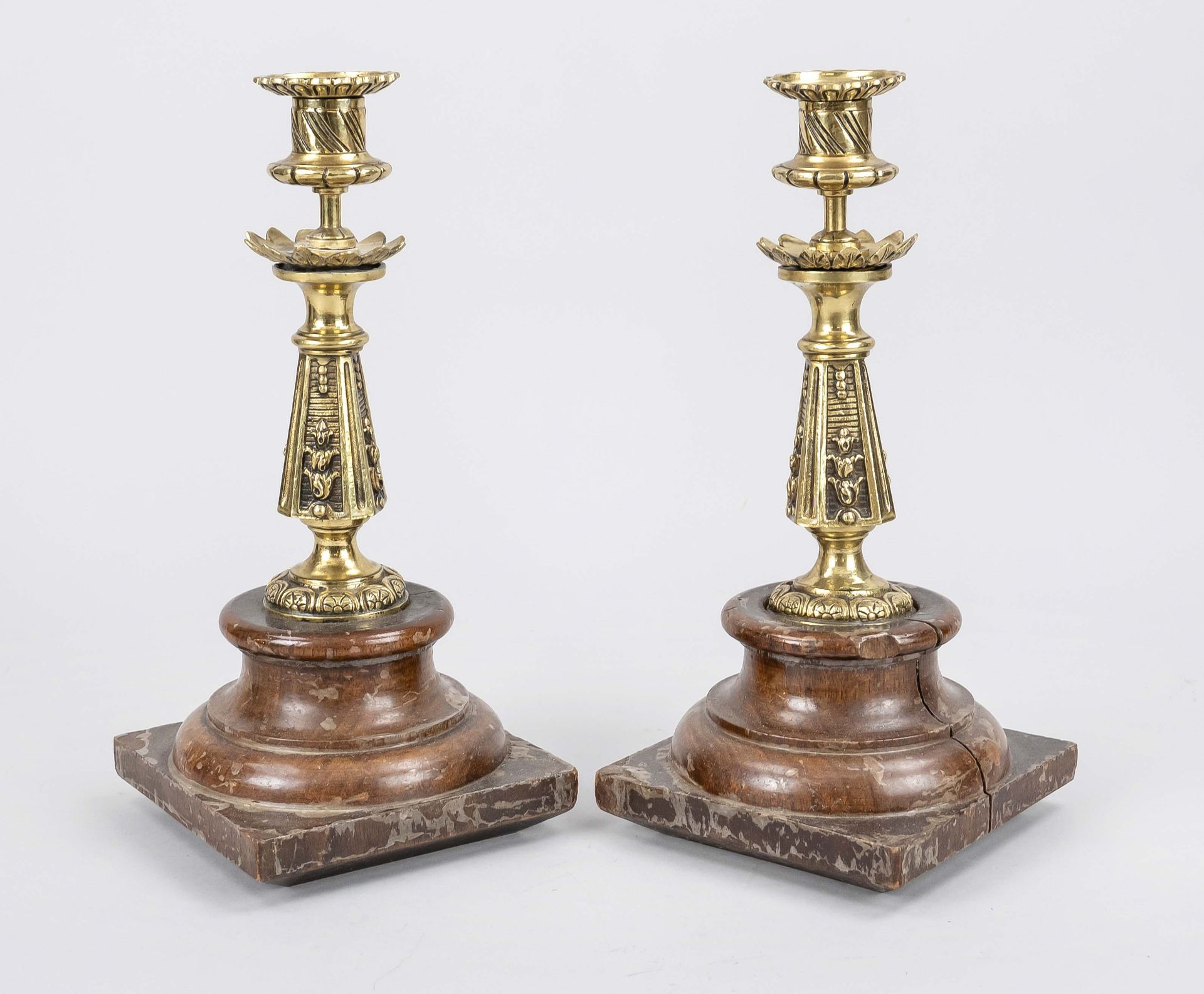 Pair of candlesticks, 19th/20th c., wood, brass. Wooden pedestal, balustrated and ornamented